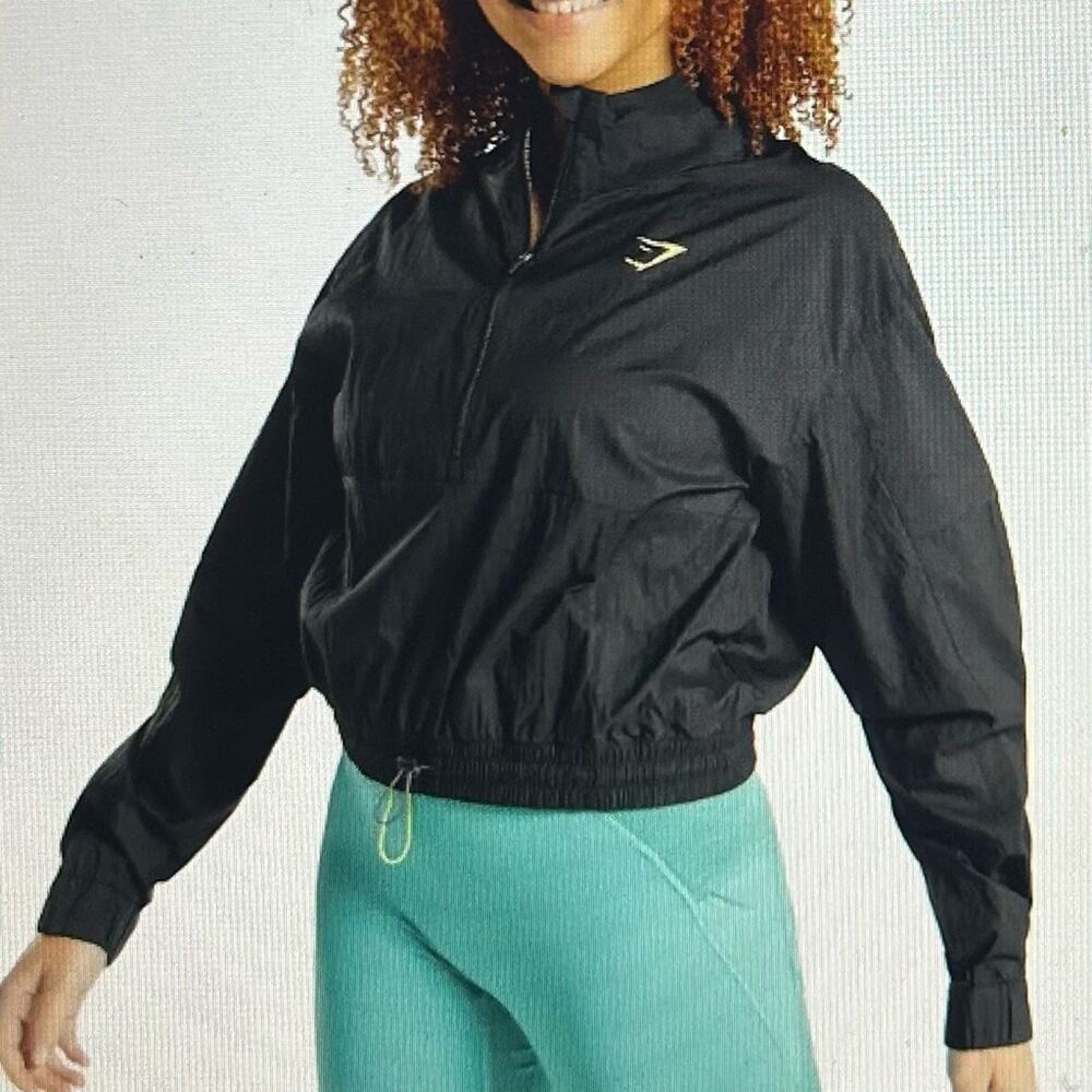 New Gymshark Pulse 1/4 zip Windbreaker Size LRG Black. 2 pockets on sleeves NWOT